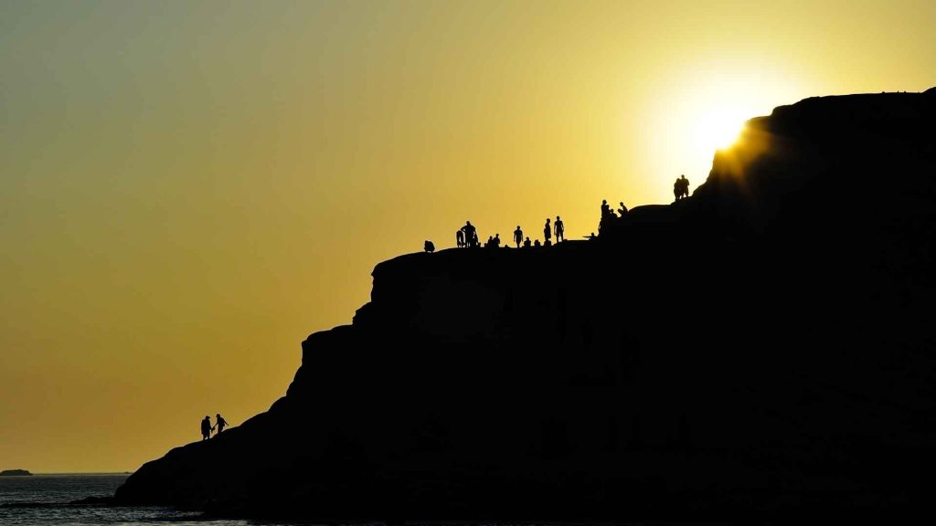 People Climbing Mountain
