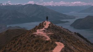 Person Standing on a Mountain Top